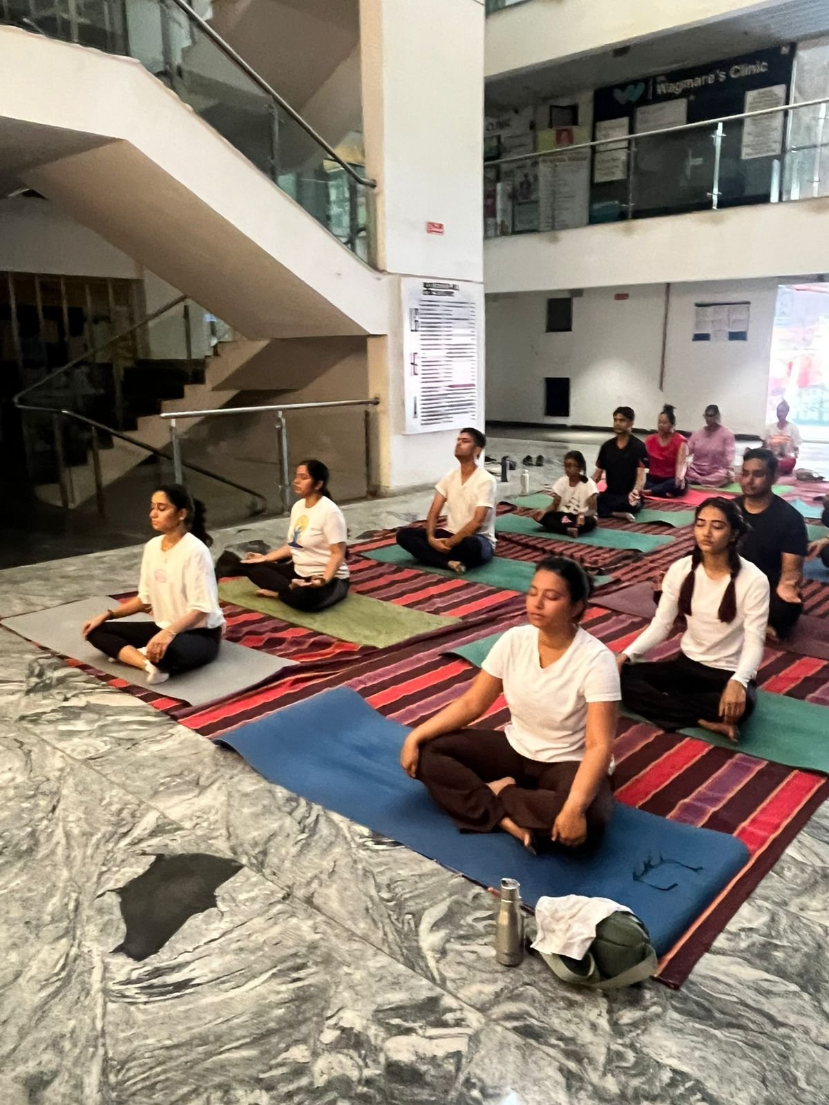 Members practicing EYM meditation at LiveFit